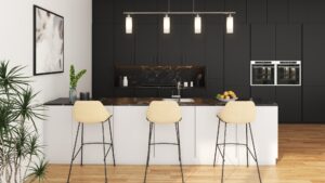3D rendered modern kitchen with black cabinetry, white island, beige bar stools, wood flooring, and pendant lighting.